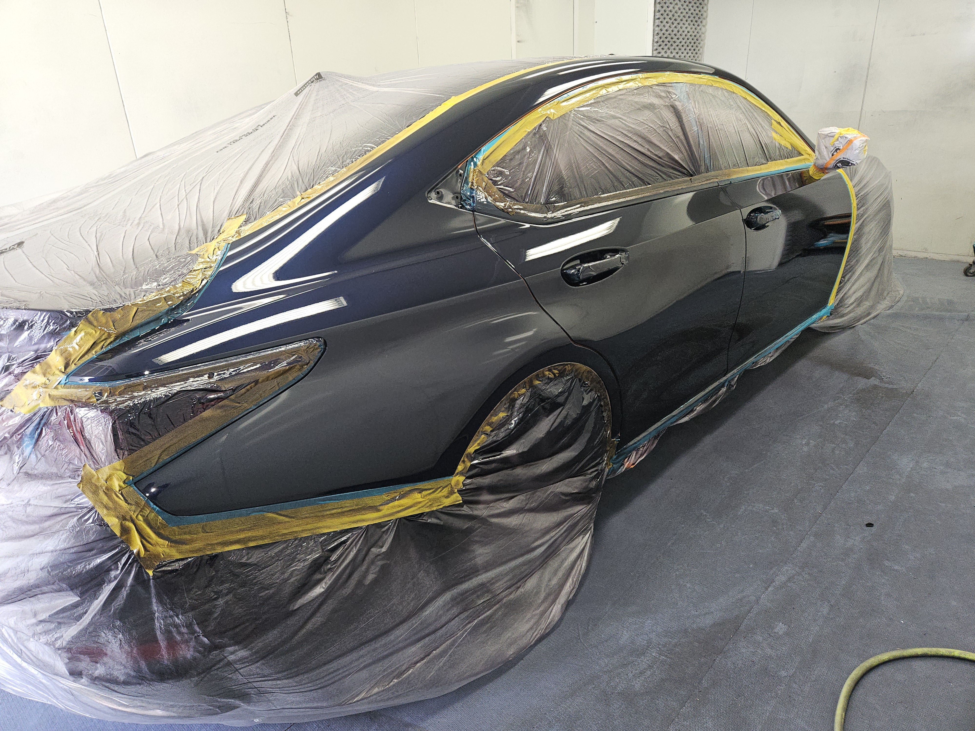 After photo of black Lexus IS sedan with deep gloss factory finish and two-stage clear coat