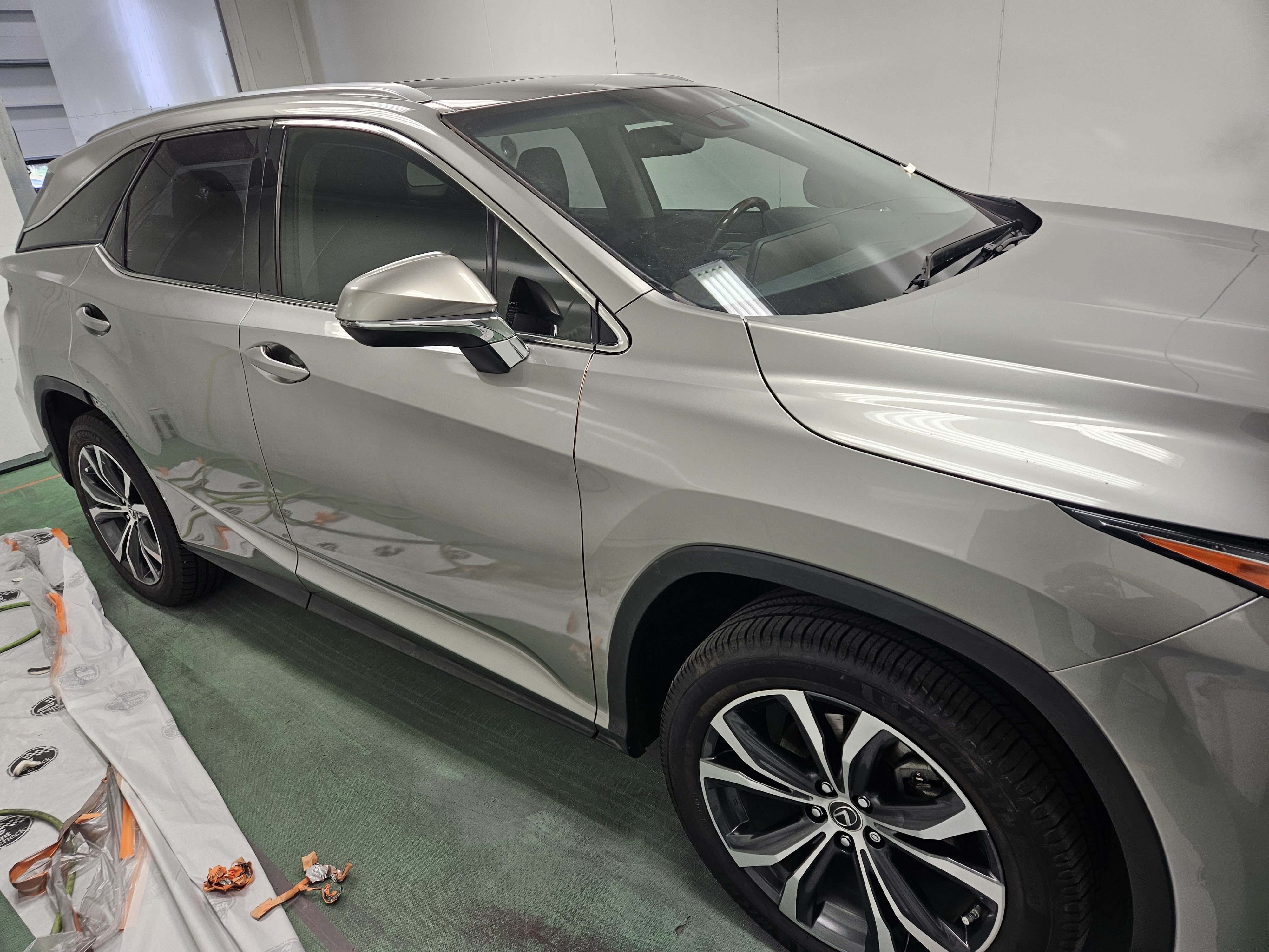 After photo of silver Lexus RX driver-side panels repainted and color-matched to factory silver