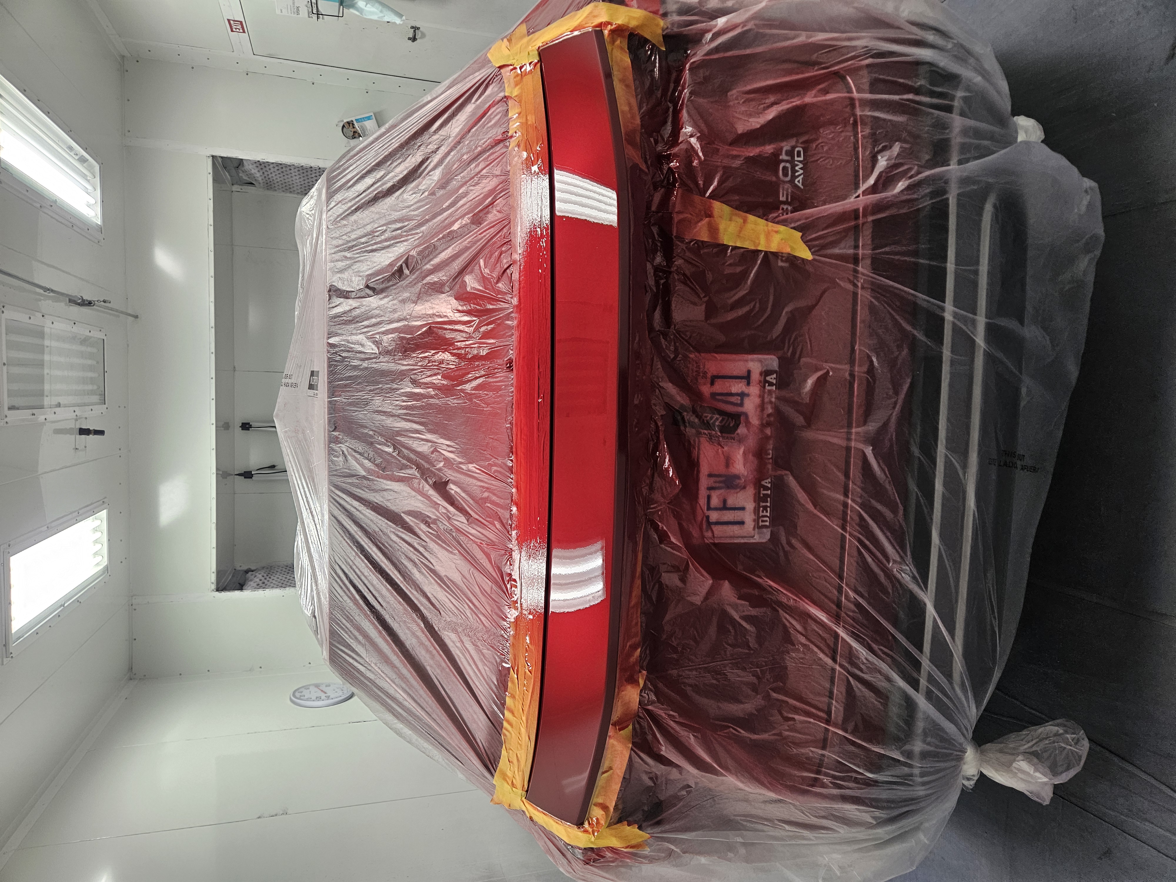 Maroon Hyundai Sonata rear quarter panel after collision repair and color-matched refinish